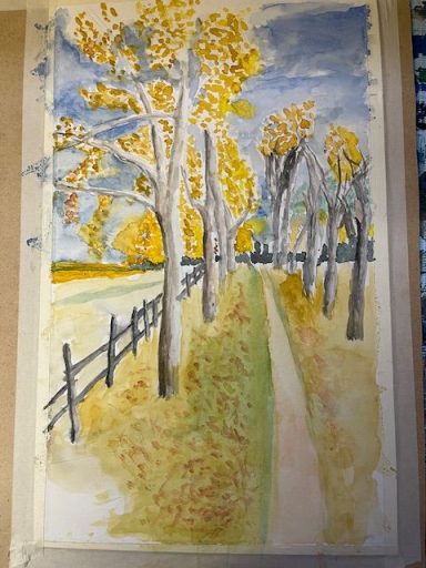 Ein Bild einer Baumreihe im Herbst in Rust am See